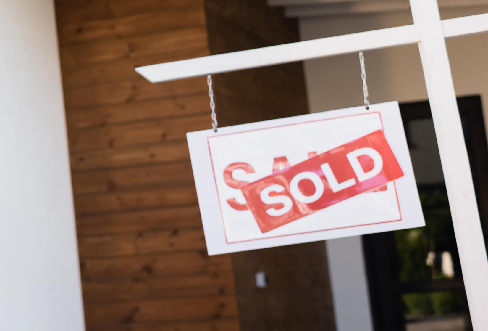 Sold sign on Burnaby home after sale with Burnaby realtor.